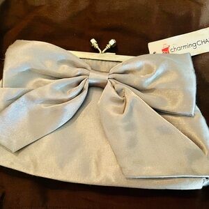 Charming Charlie Metallic Silver Bow Clutch